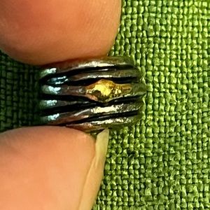 Pandora silver charm with gold accents, wrapped/stacked design, 1/4” x 1/2”